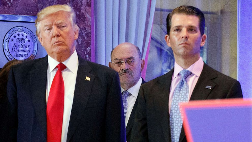 PHOTO: In this Jan. 11, 2017, file photo, Allen Weisselberg, center, stands between President-elect Donald Trump, left, and Donald Trump Jr., at a news conference in the lobby of Trump Tower in New York.