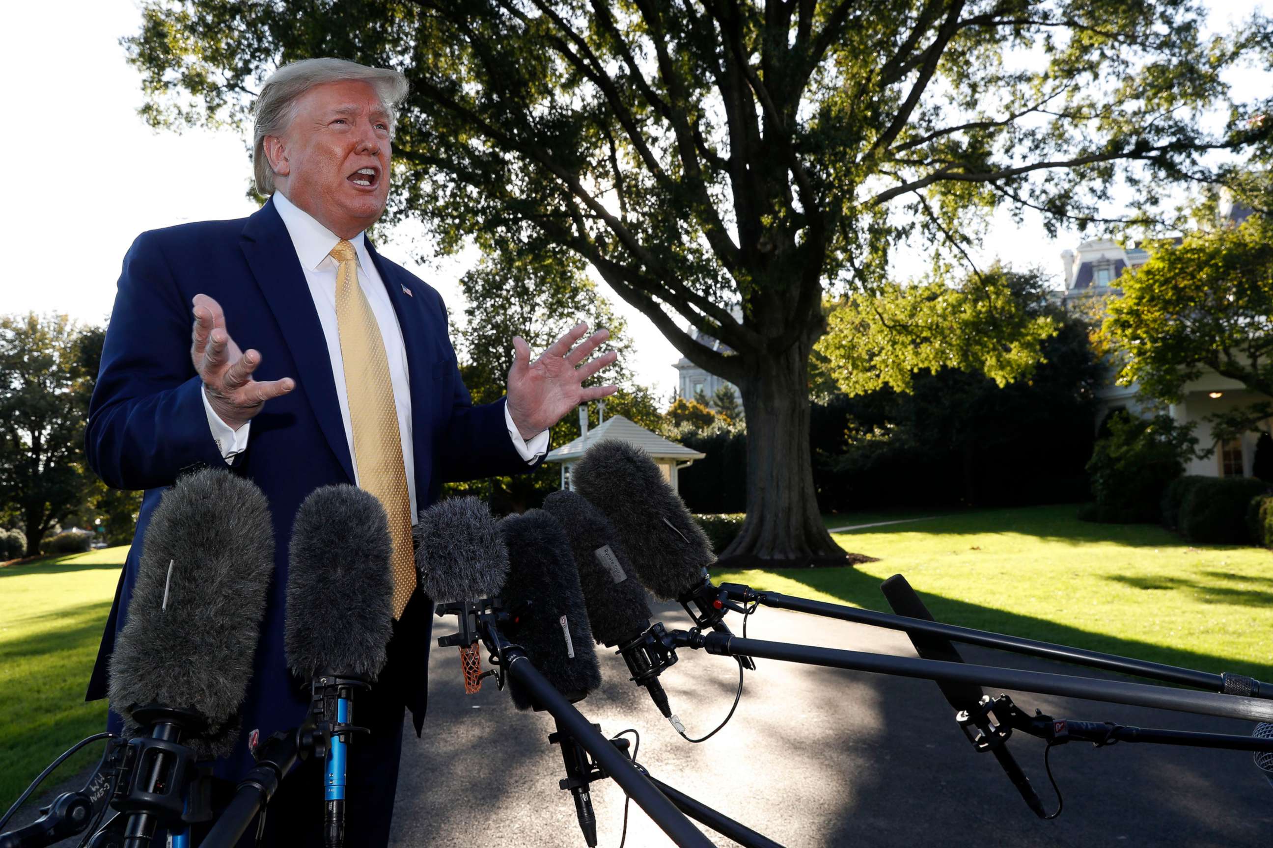 PHOTO: President Donald Trump speaks with reporters on the South Lawn of the White House in Washington, Oct. 11, 2019, before departing for a campaign rally in Lake Charles, La.