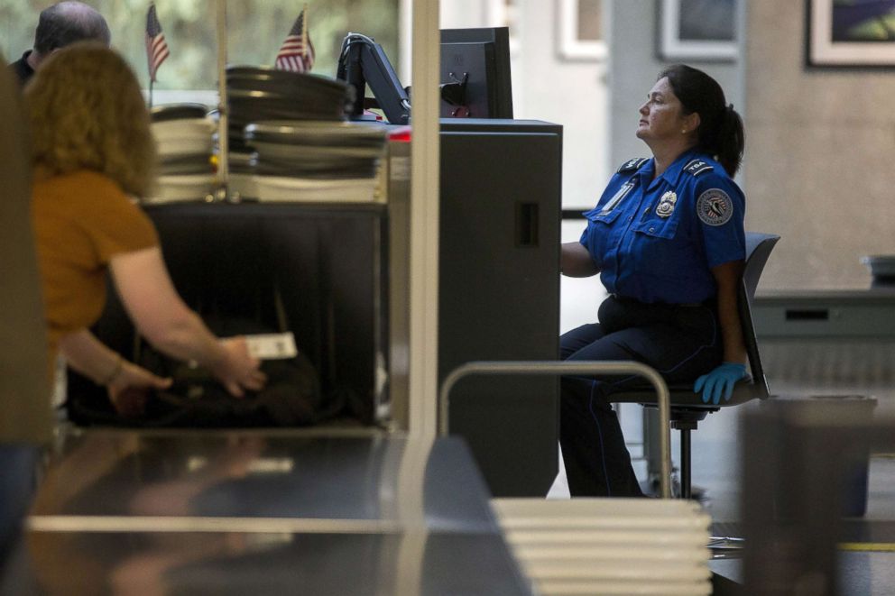 PHOTO: In this file photo, a Transportation Security Administration (TSA) officer operates an x-ray machine in the TSA pre-check area at Dulles International Airport in Dulles, Virginia, U.S., Aug. 19, 2015. 