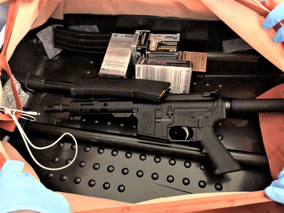 PHOTO: TSA officials released this image with a press release stating that officers at Newark Liberty International Airport found this assault rifle and ammunition concealed in the lining of a traveler's suitcase on July 20, 2020.