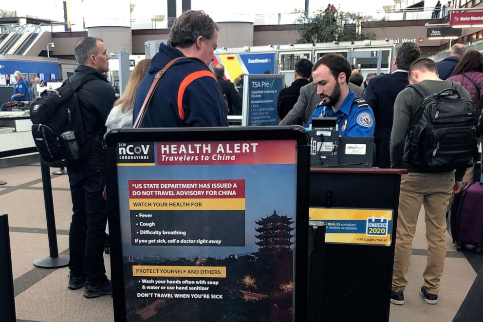 PHOTO: In this file photo taken on March 2, 2020, a health alert for people traveling to China is shown at a TSA security checkpoint at the Denver International Airport in Denver, Colorado.