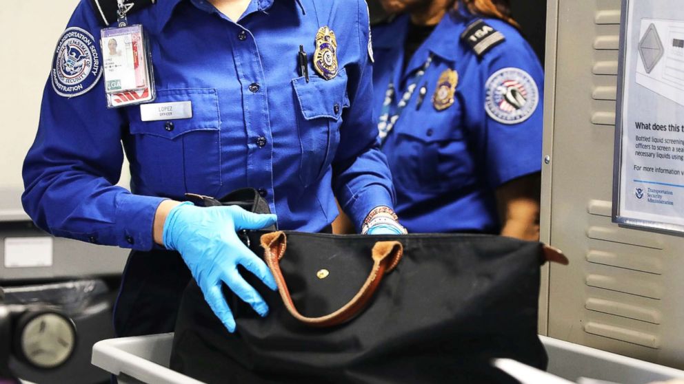 A Transportation Security Administration (TSA) worker screens luggage at LaGuardia Airport (LGA) on Sept. 26, 2017, in New York City.