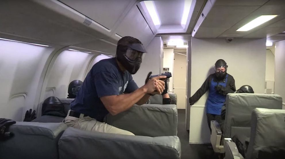 PHOTO: Federal Air Marshals participate in mock-terrorism drills on airplane simulations during months of training for the job.