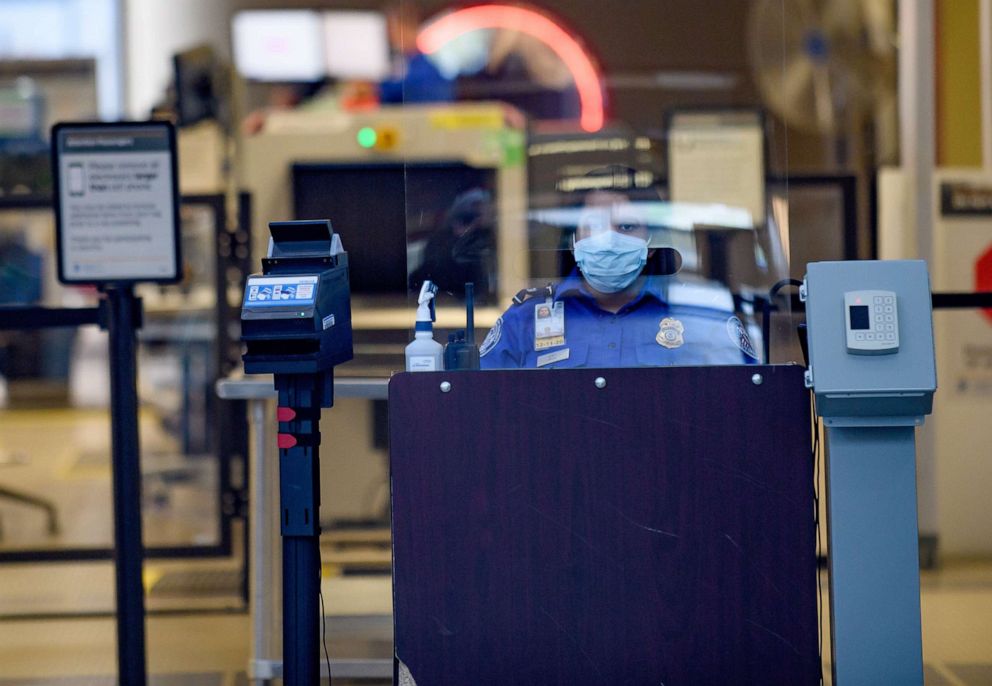 PHOTO: A TSA worker waits for travellers at the Pittsburgh International Airport, May 7, 2020, in Pittsburgh, Pa.