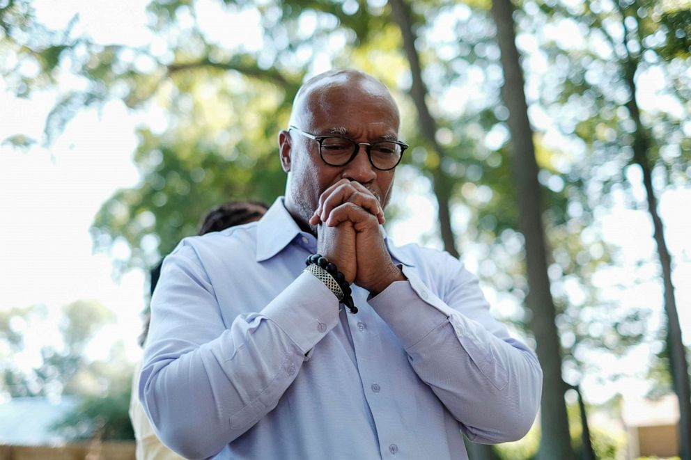 PHOTO: Verrandall S.Tucker, a descendent of William Tucker, pays respects to a family member buried at the Tucker family cemetery in Hampton, Virginia, July 27, 2019.