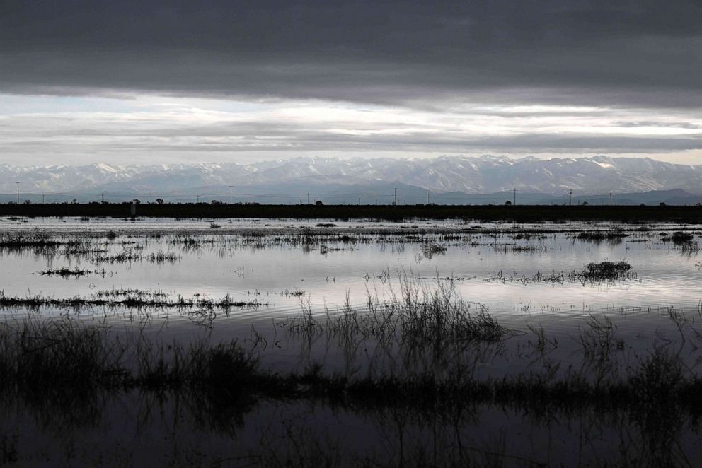 PHOTO: Flooding is shown on farm land in the Central Valley as the Sierra Nevada mountain range stands on the horizon in Tulare County near Allensworth, Calif., on March 22, 2023.