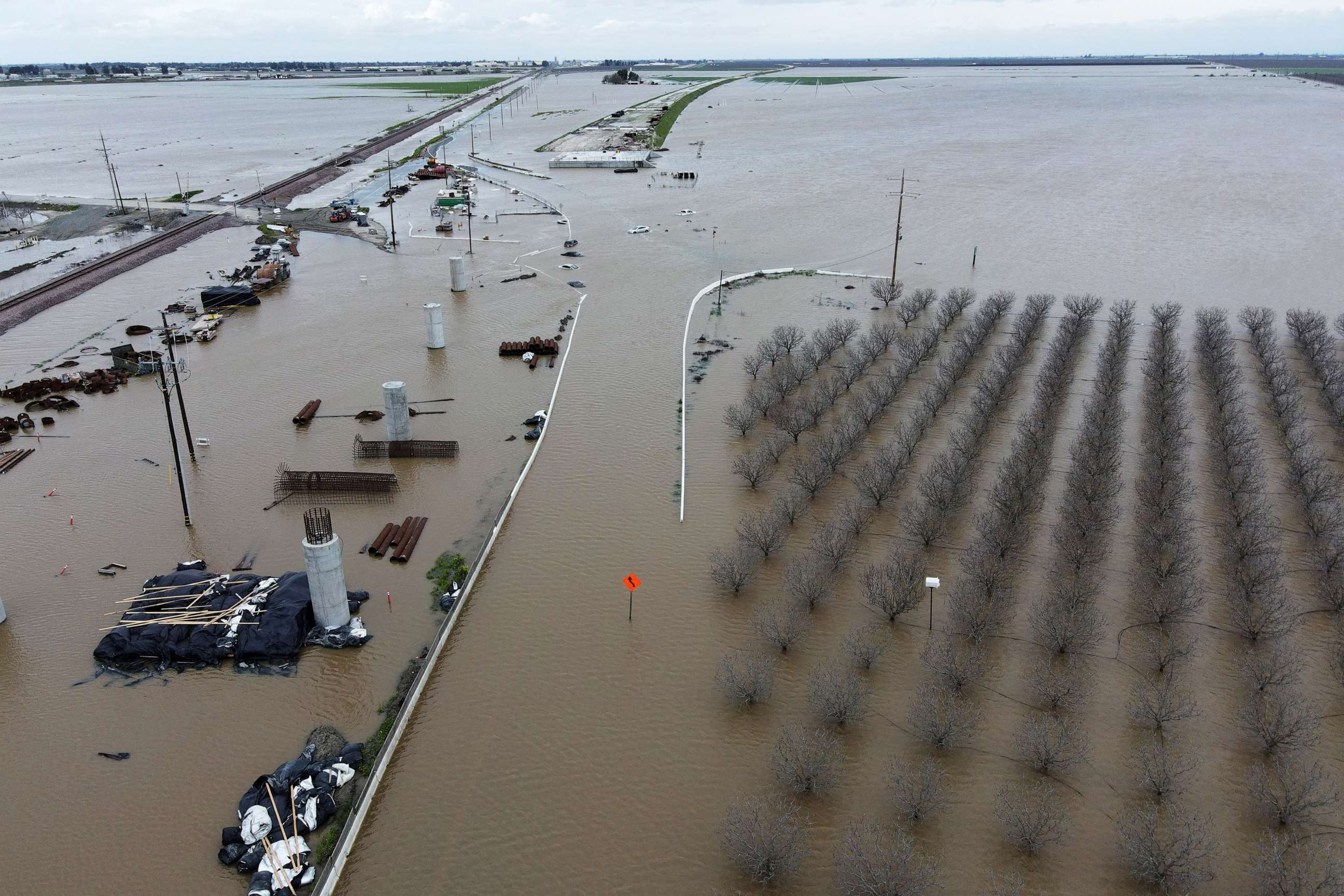 PHOTO: Orchards sit in floodwaters from the Tule River inundate the area after days of heavy rain in Corcoran, Calif., on March 21, 2023.