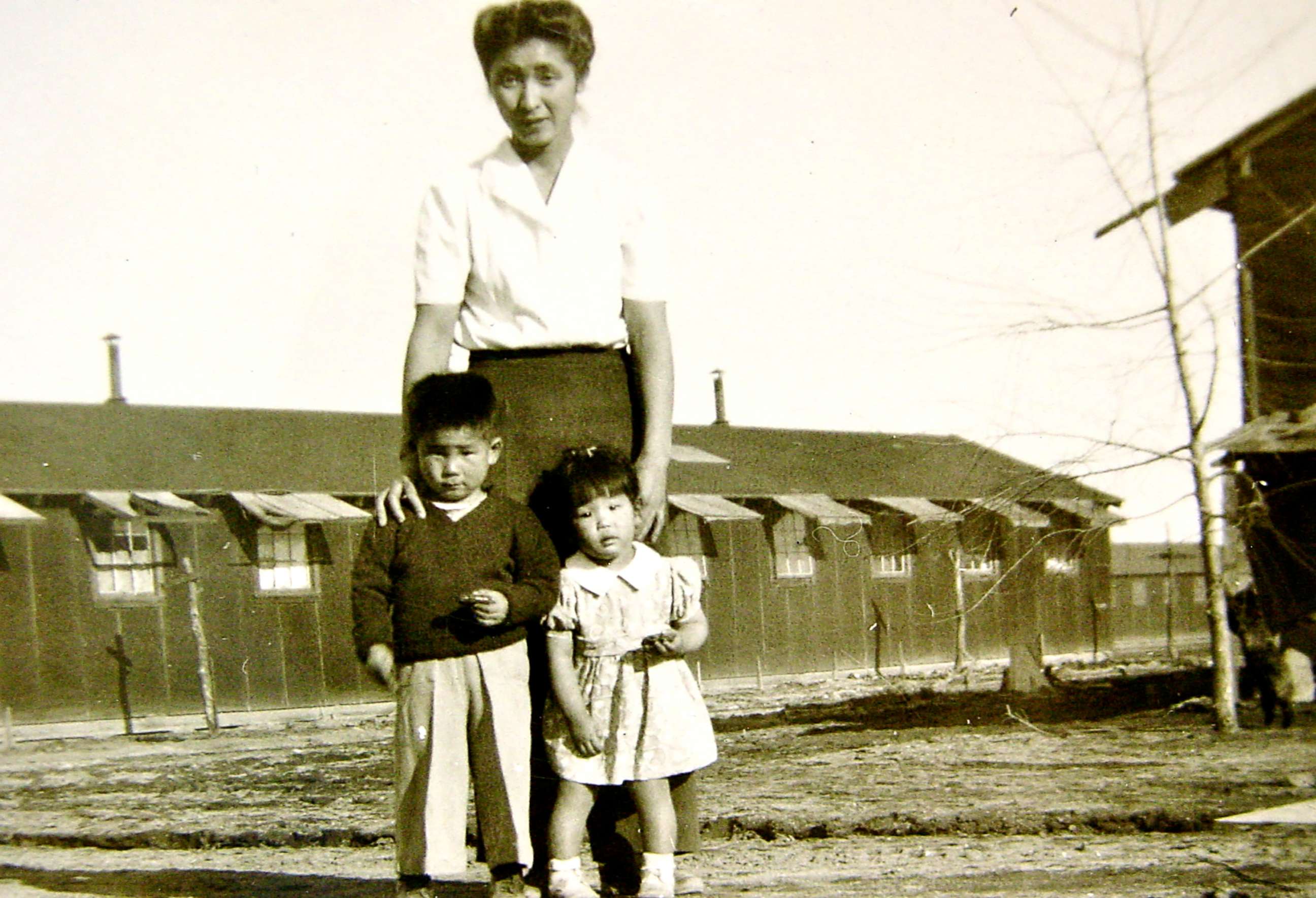 PHOTO: Shizuko Ina, Kiyoshi Ina and Satsuki Ina in Tule Lake after their father was taken and incarcerated in North Dakota. Photo taken at Tule Lake Segregation Center, Ca., 1945.