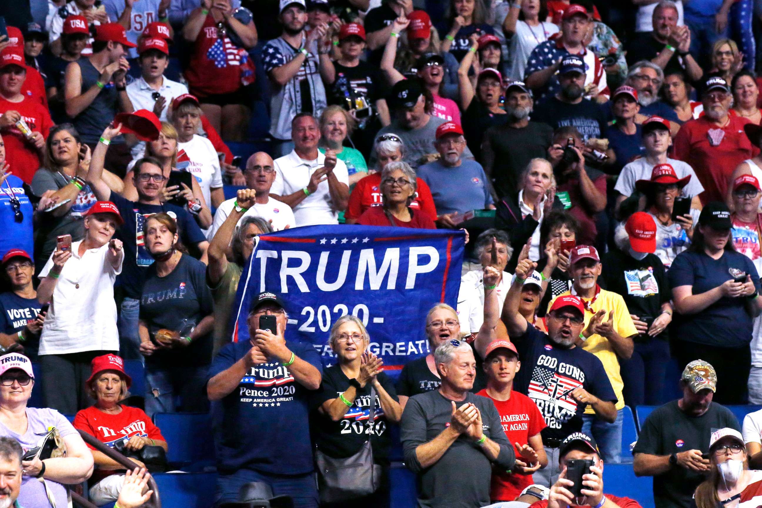 PHOTO: President Donald Trump supporters cheer Eric Trump, the son of President Donald Trump, not pictured, before a Trump campaign rally in Tulsa, Okla., June 20, 2020. 