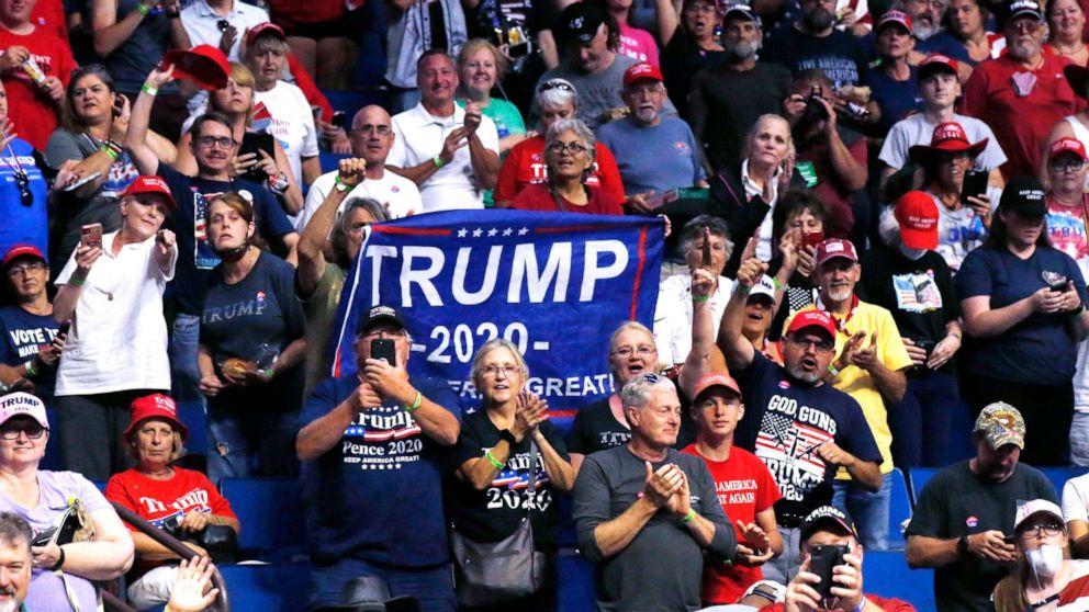 PHOTO: President Donald Trump supporters cheer Eric Trump, the son of President Donald Trump, not pictured, before a Trump campaign rally in Tulsa, Okla., June 20, 2020. 