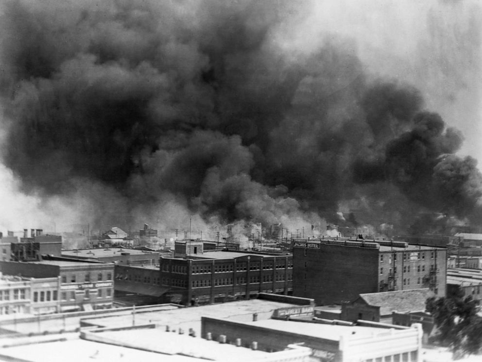 PHOTO: Black smoke billows from fires during the race riot of 1921, in Tulsa, Okla.