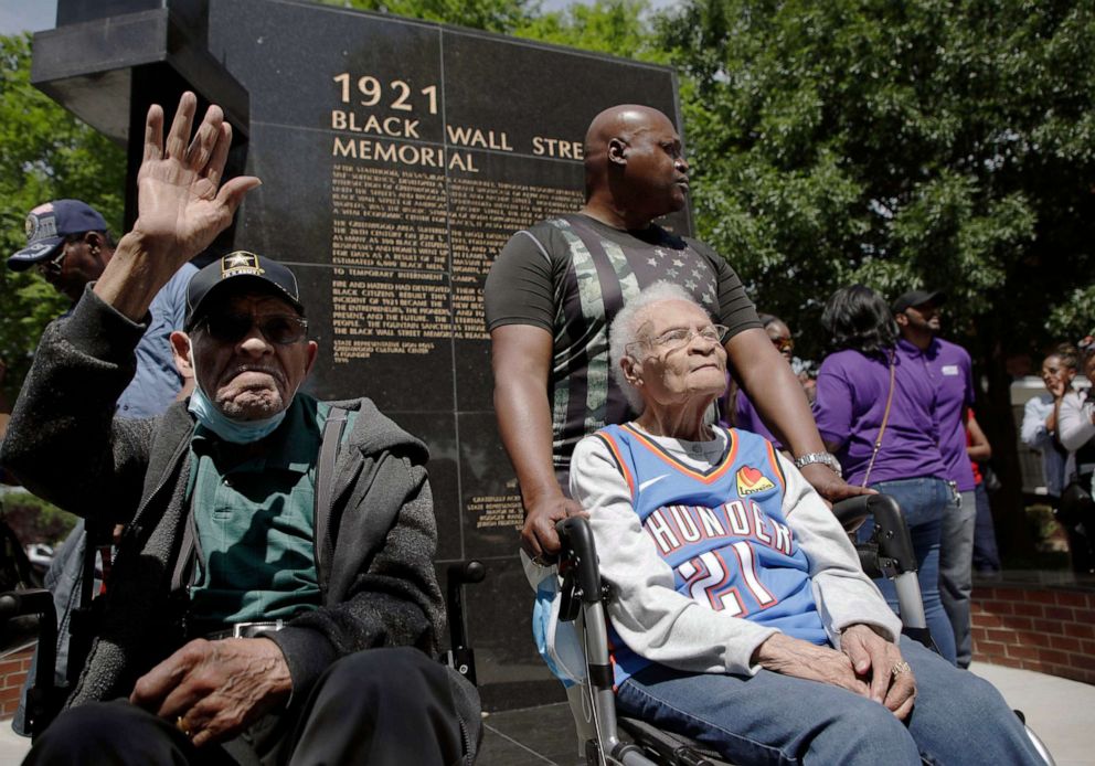 PHOTO: Survivors of the 1921 Tulsa Race Massacre, Hughes "Uncle Red" Van Ellis and Viola Fletcher, visit the 1921 Black Wall Street Memorial after a march, May 28, 2021, in Tulsa, Okla.
