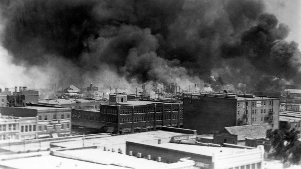 PHOTO: Black smoke billows from fires during the Tulsa Race Massacre of 1921, in the Greenwood District, Tulsa, Oklahoma, June 1921.