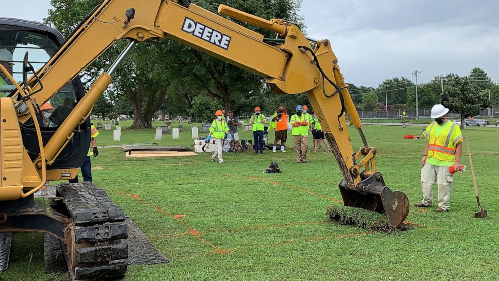 PHOTO: Workers break ground at Oaklawn Cemetery in north Tulsa, Okla., on July 13, 2020, searching for a potential mass grave of victims of the race massacre that occurred in this city in 1921.