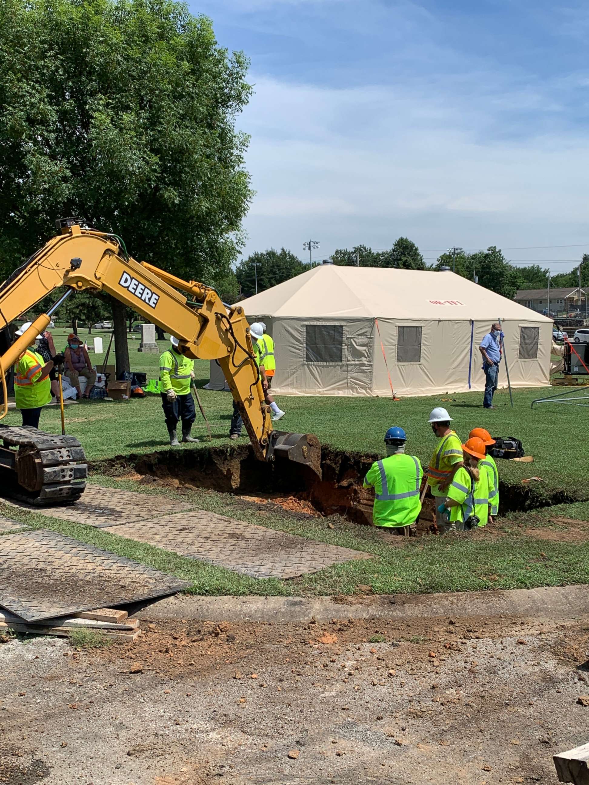 PHOTO: Workers break ground at Oaklawn Cemetery in north Tulsa, Okla., on July 13, 2020, searching for a potential mass grave of victims of the race massacre that occurred in this city in 1921.