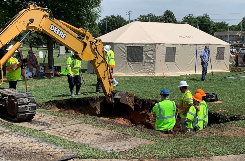 PHOTO: Workers break ground at Oaklawn Cemetery in north Tulsa, Okla., on July 13, 2020, searching for a potential mass grave of victims of the race massacre that occurred in this city in 1921.