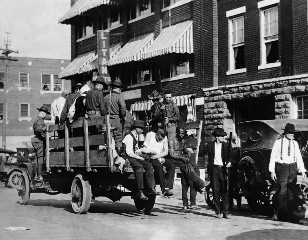 PHOTO: In this June 2, 1921, file photo, injured and wounded men are being taken to hospital by National guardsmen after racially motivated riots, also known as the "Tulsa Race Massacre", in Tulsa, Okla.