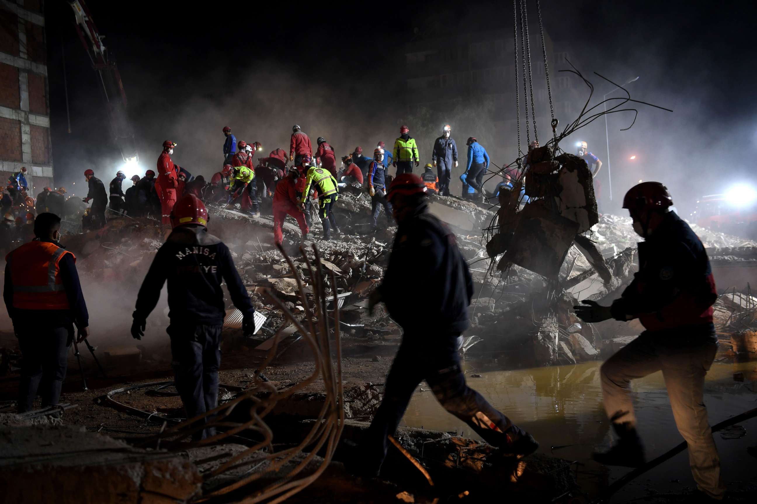 PHOTO: Search and rescue teams look for victims at the site of a collapsed building in Izmir, Turkey, Nov. 2, 2020, after a powerful earthquake struck Turkey's western coast and parts of Greece two days ago. 