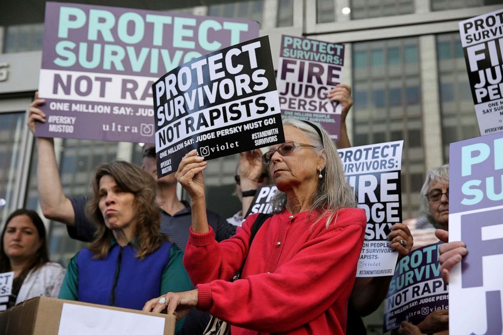 PHOTO: Activists from UltraViolet hold up signs before delivering over one million signatures to the California Commission on Judicial Performance calling for the removal of Judge Aaron Persky from the bench at a rally in San Francisco, June 10, 2016.