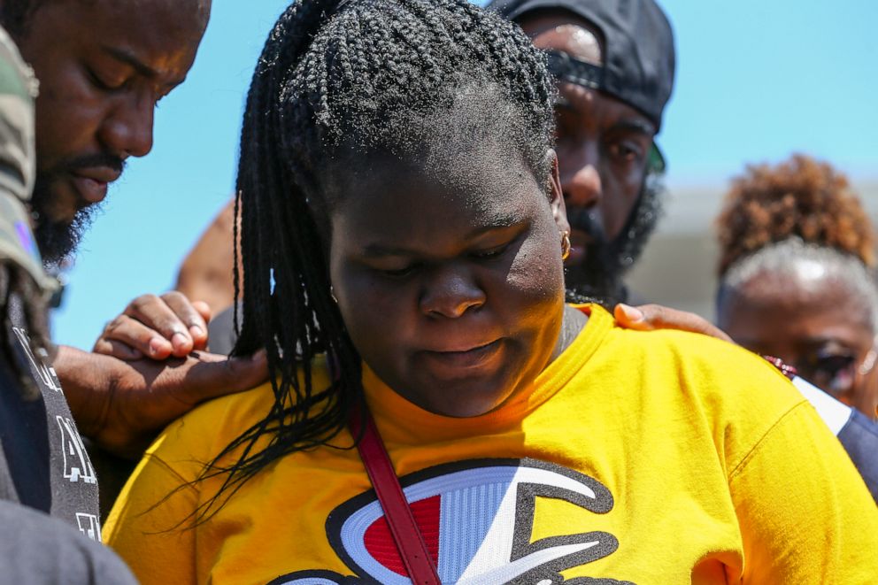 PHOTO:Chelsie Rubin, center, surrounded by supporters gather in prayer in front of the memorial in Baytown, Texas, May 15, 2019, for her mother, Pamela Turner, who was killed May 11 during a confrontation with a Baytown Police officer.