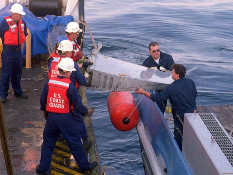 PHOTO: U.S. Coast Guard crewmen collect parts of the TWA jetliner from the waters off Long Island's south shore, July 18, 1996.