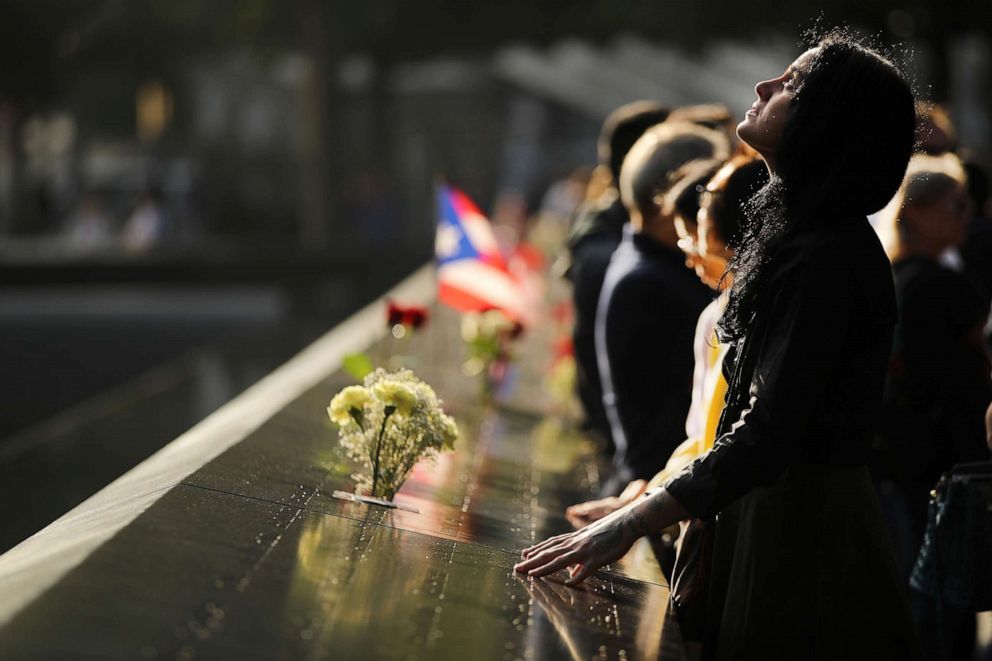 PHOTO: Alexandra Hamatie, whose cousin Robert Horohoe was killed on September 11, pauses at the National September 11 Memorial during a morning commemoration ceremony for the victims of the terrorist attacks, Sept. 11, 2019, in New York City.