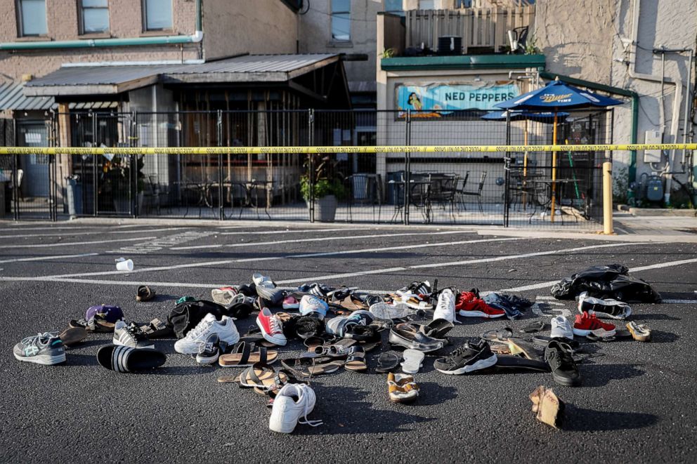 PHOTO: Shoes are piled outside Ned Peppers bar, the scene of a mass shooting, Aug. 4, 2019, in Dayton, Ohio.