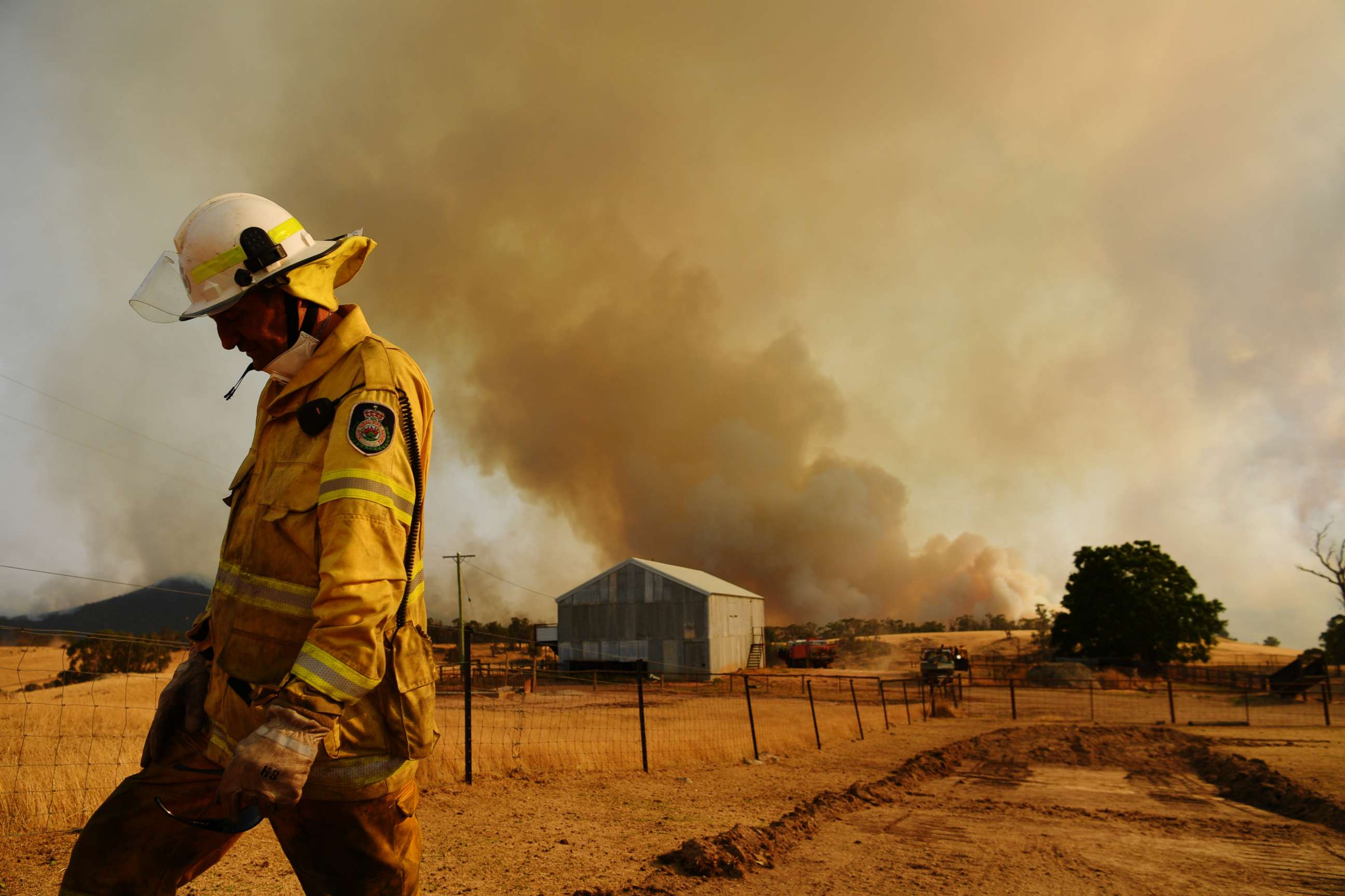 PHOTO: A Rural Fire Service firefighter views the flank of a fire, Jan. 11, 2020, in Tumburumba, Australia. 


