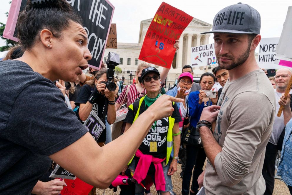 PHOTO: Abortion rights advocates have a heated discussion with a man who is anti-abortion outside the Supreme Court in Washington, May 14, 2022.