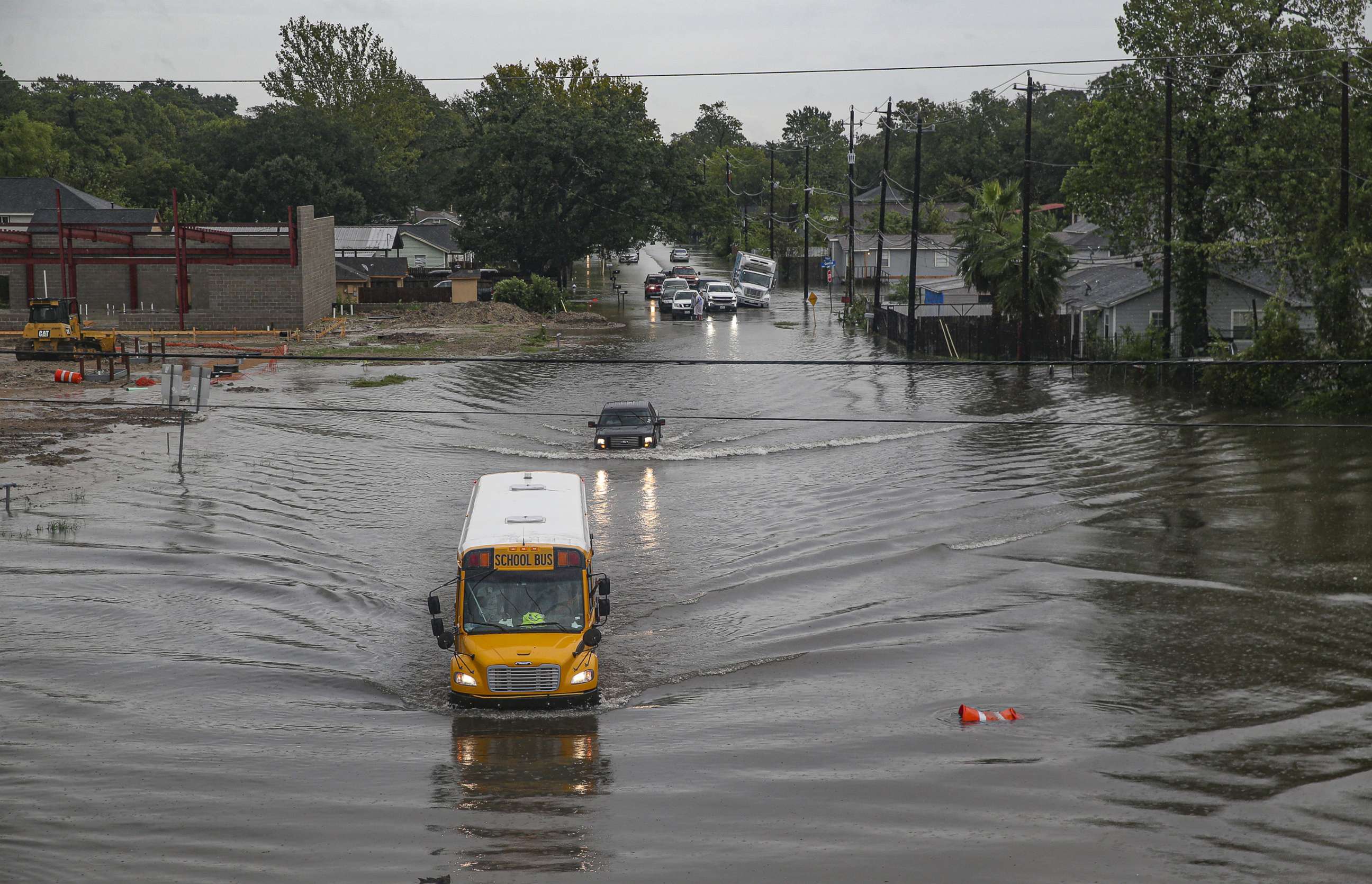 PHOTO: HOUSTON, TX - SEPTEMBER 19: A school bus makes its way on the flooded Hopper Rd. on September 19, 2019 in Houston, Texas. 