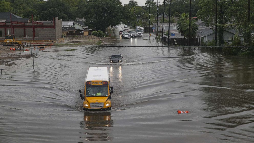 PHOTO: HOUSTON, TX - SEPTEMBER 19: A school bus makes its way on the flooded Hopper Rd. on September 19, 2019 in Houston, Texas. 