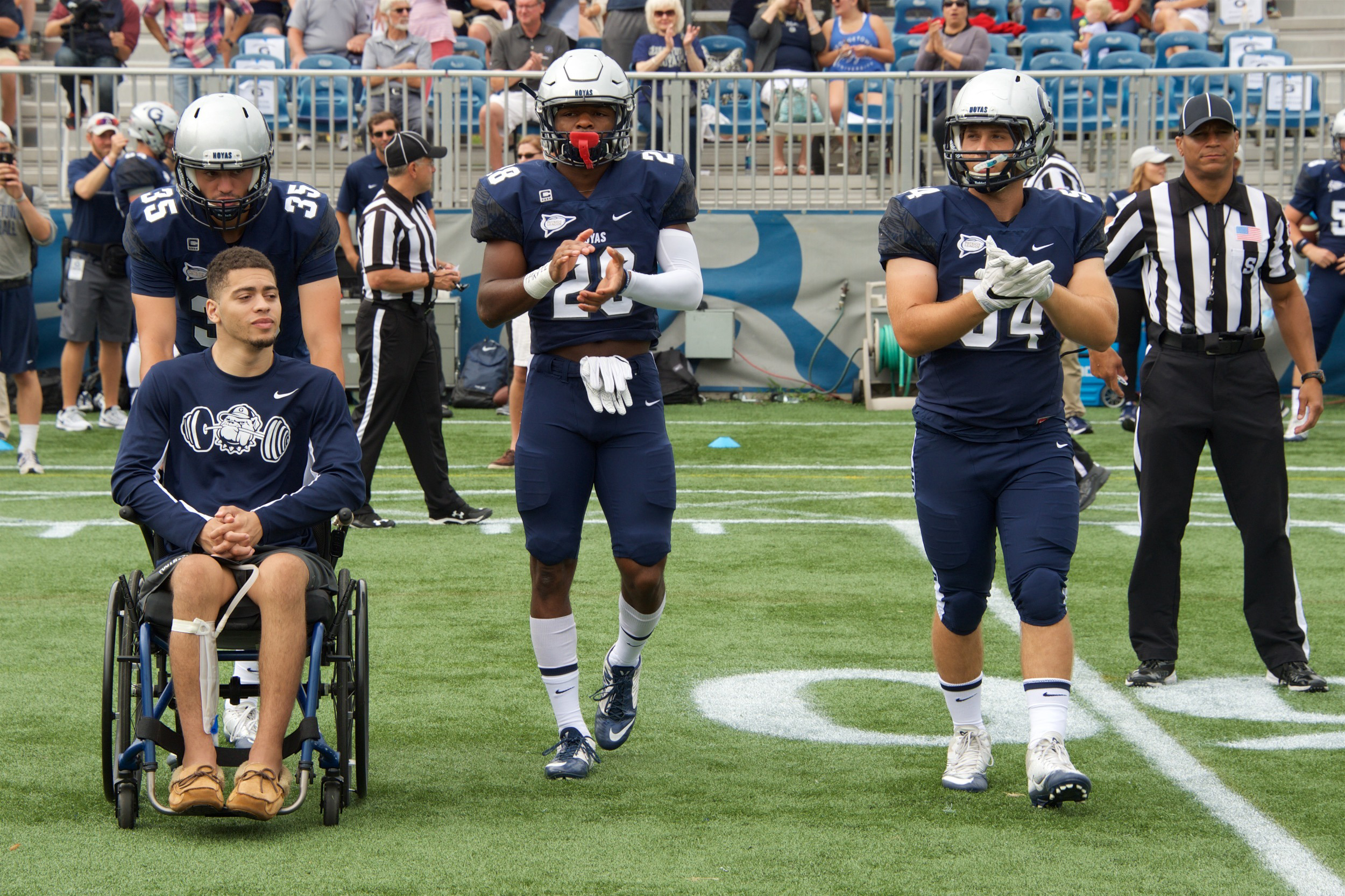 PHOTO: Ty Williams heads to midfield for the coin toss vs. Davidson as a team captain in September 2016. He was injured during a game in 2015.