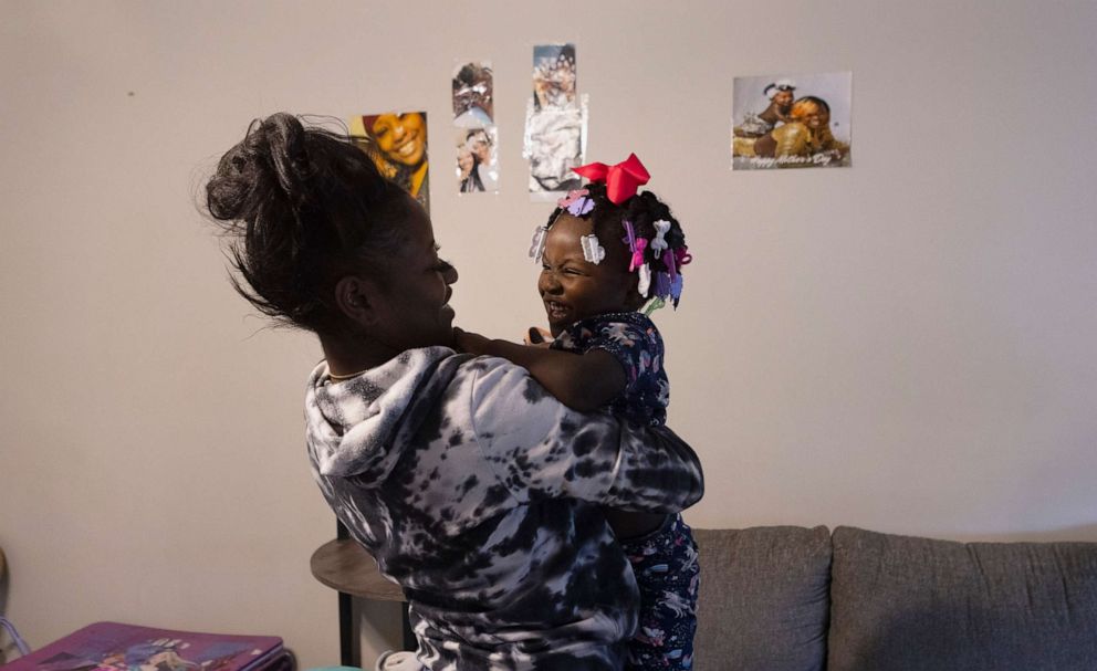 PHOTO: Tykirel Jordan holds her daughter, Alaysia, 3, at their apartment in Birmingham, Ala.