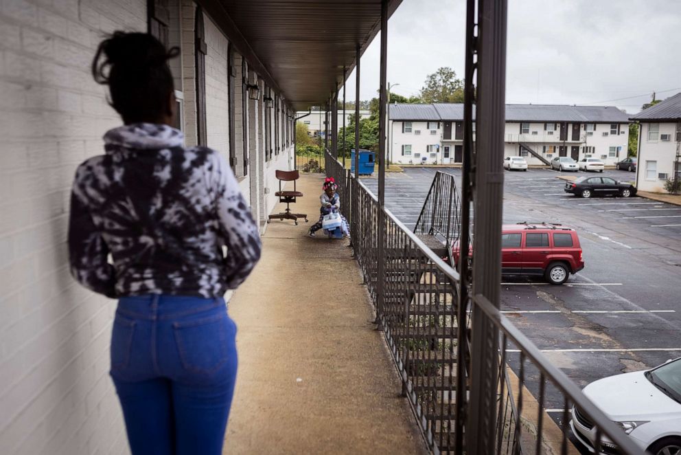 PHOTO: Tykirel Jordan, watchers her daughter Alaysia play outside the apartment where they live in Birmingham, Ala., in late October 2021.