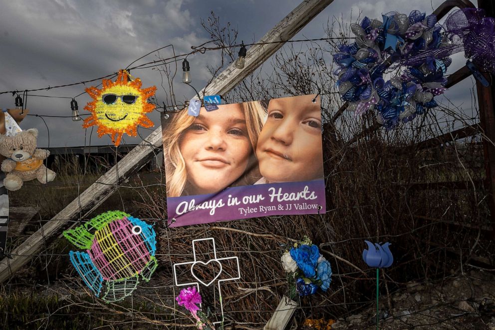 PHOTO: A banner with photos of Tylee Ryan and her brother J.J. Vallow decorates a fence set up as a memorial near where her body was found, May 10, 2023, in Rexburg, Idaho.