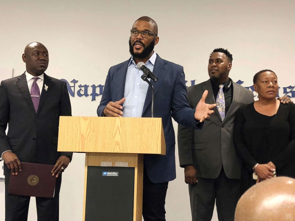 PHOTO: Filmmaker Tyler Perry, center, speaks to a a press conference announcing a lawsuit against former Collier County Sheriffs Deputy Steven Calkins, Sept. 4, 2018 in Naples, Fla.