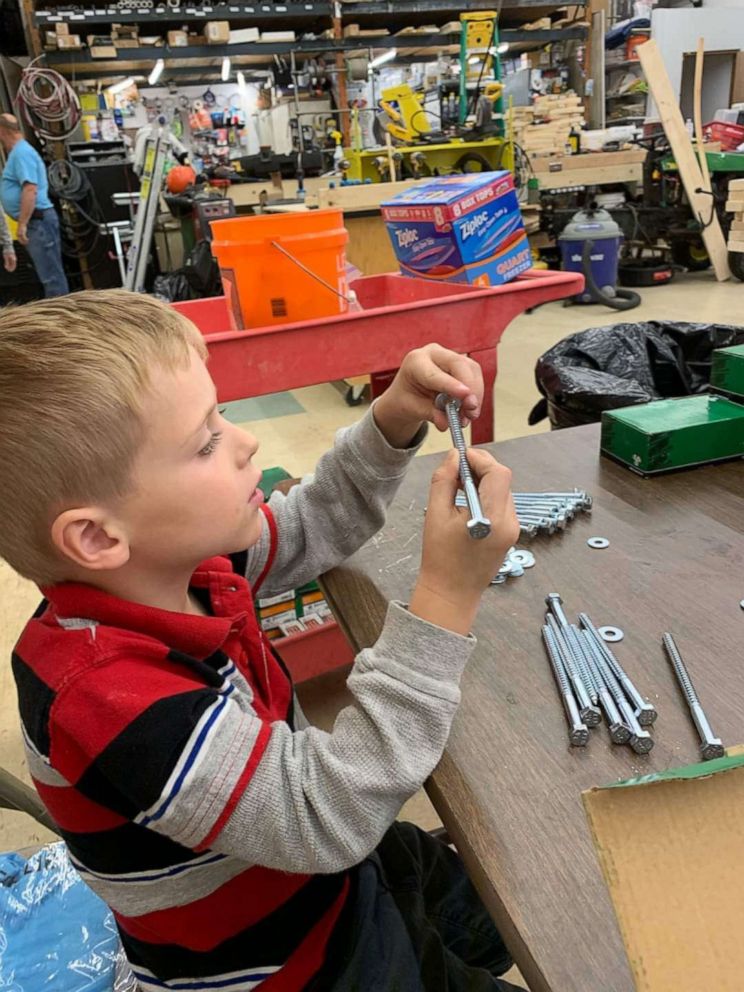 PHOTO: Tyler Sliz, 5, makes bags of bolts, which are then used to assemble beds for children in need.
