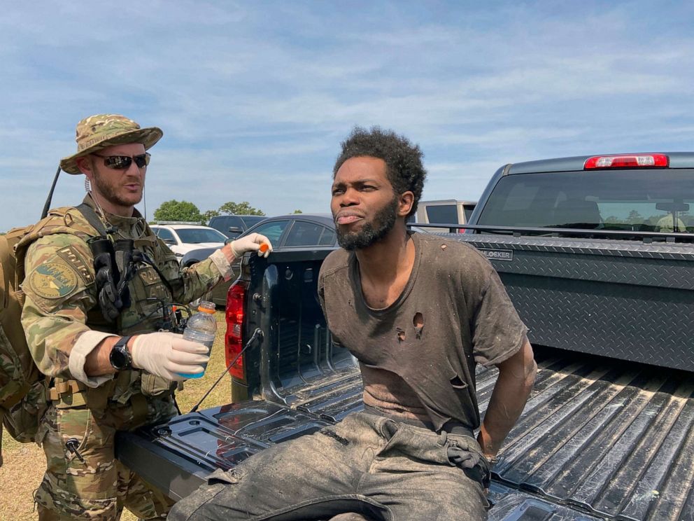 PHOTO: In this photo provided by the Chester County Sheriff's Office, Tyler Terry is offered water during his arrest in South Carolina, May 24, 2021.