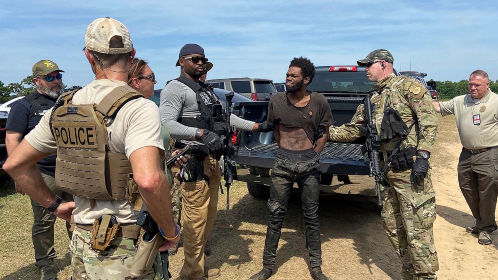 A man wanted in connection to several murders and shootings in South Carolina was taken into custody Monday.