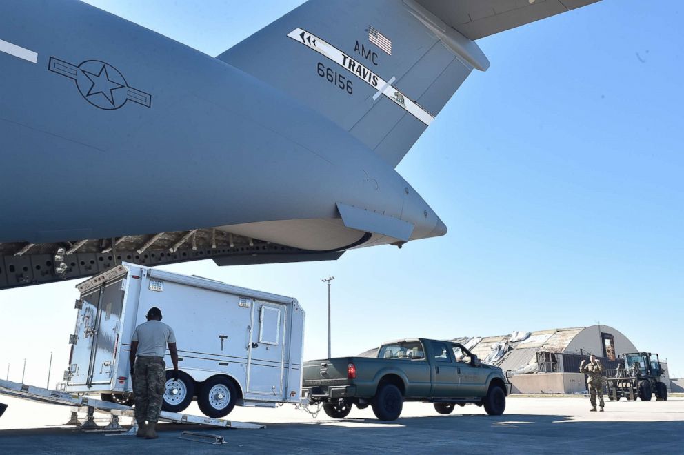PHOTO: 821st Contingency Response Group Airmen offload their mobile command and control trailer from a Travis Air Force Base C-17 Globemaster III, at Tyndall Air Force Base, Florida, Oct. 12, 2018.