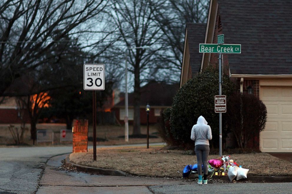 PHOTO: A person pays their respects as balloons, notes, candles, other offerings are visible at the site where Tyre Nichols was severely beaten by Memphis police officers, and died in a hospital three days later in Memphis, Tennessee, Jan. 28, 2023.