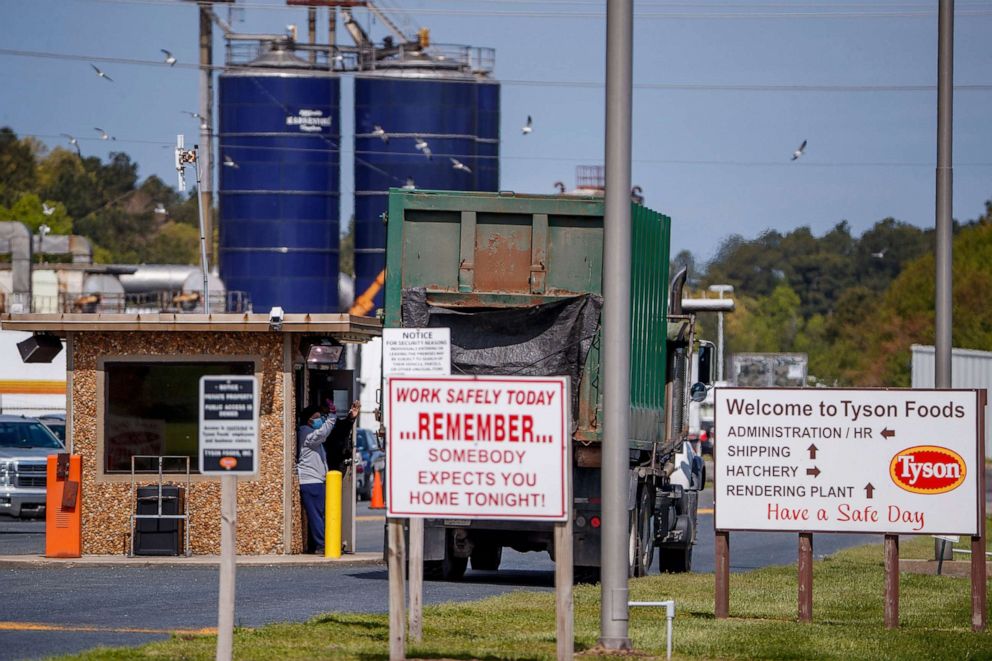 PHOTO: A security officer checks vehicles at the entrance to the Tyson Temperanceville Complex in Temperanceville, Va., April 28, 2020.