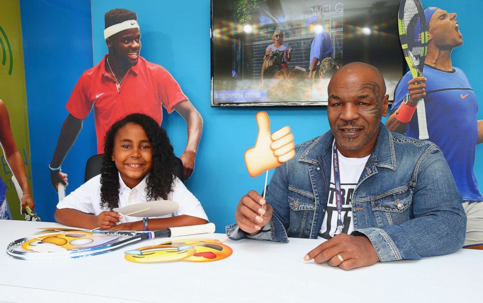 PHOTO: Mike Tyson and daughter Milan are seen at the Kidcaster Booth for Net Generation during the 2017 U.S. Open at the USTA Billie Jean King National Tennis Center on Aug. 28, 2017 in New York City.