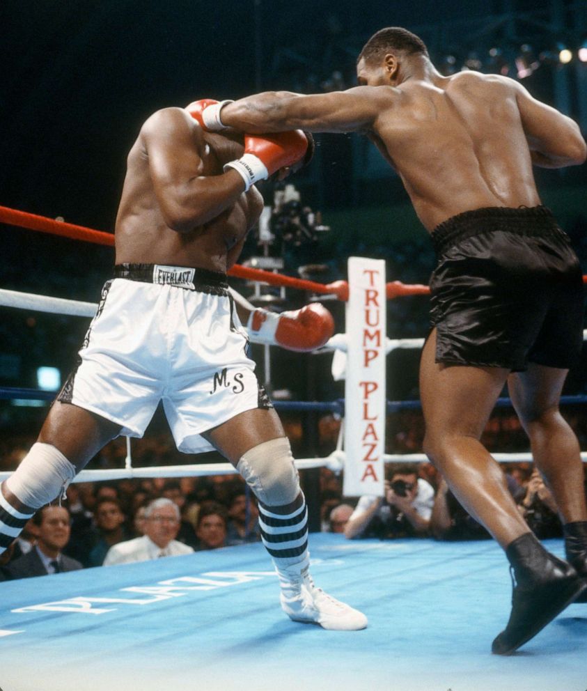 PHOTO: Michael Spinks and Mike Tyson fight for the WBC, WBA and Ring Heavyweight titles on June 27, 1988 at the Convention Hall in Atlantic City, N.J.