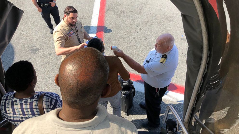 PHOTO: Disembarking passengers have their temperatures checked in a photo shared by a passenger after a United Emirates plane landed at JFK International Airport in New York, Sept. 5, 2018.