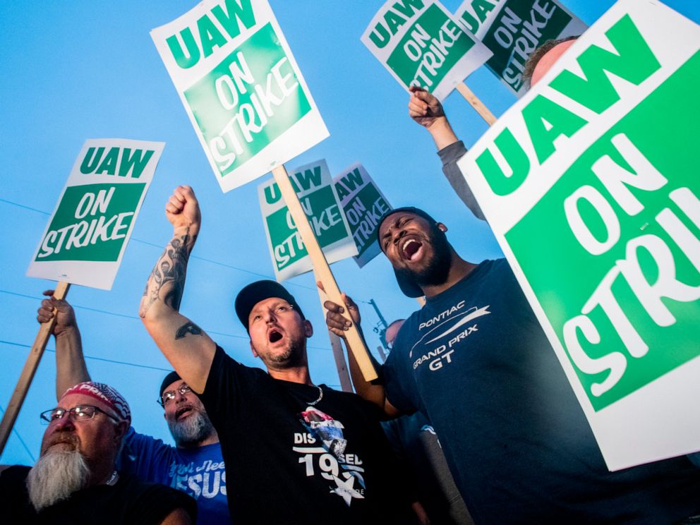 PHOTO: General Motors employees Bobby Caughel, left, and Flint resident James Crump, shout out as they protest with other GM employees, United Auto Workers members and labor supporters outside of the Flint Assembly Plant, Sept. 16, 2019 in Flint, Mich.