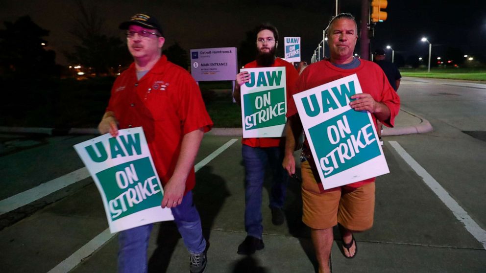 PHOTO: United Auto Workers members picket outside the General Motors Detroit-Hamtramck assembly plant in Hamtramck, Mich., early Monday, Sept. 16, 2019. 