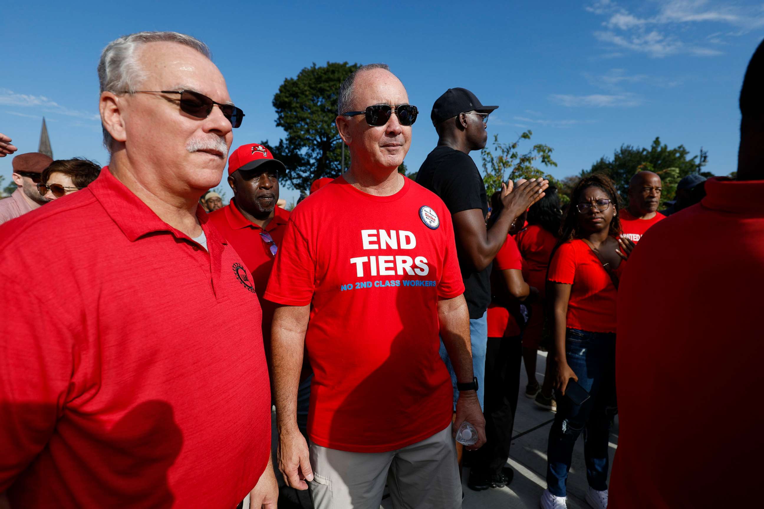 PHOTO: United Auto Workers President Shawn Fain, center, attends a rally with union members after marching in the Detroit Labor Day Parade on September 4, 2023 in Detroit, Michigan.