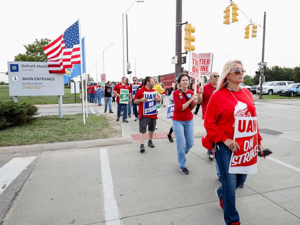 PHOTO: Striking United Auto Workers union members picket at the General Motors Detroit-Hamtramck Assembly Plant on September 25, 2019, in Detroit, Michigan.