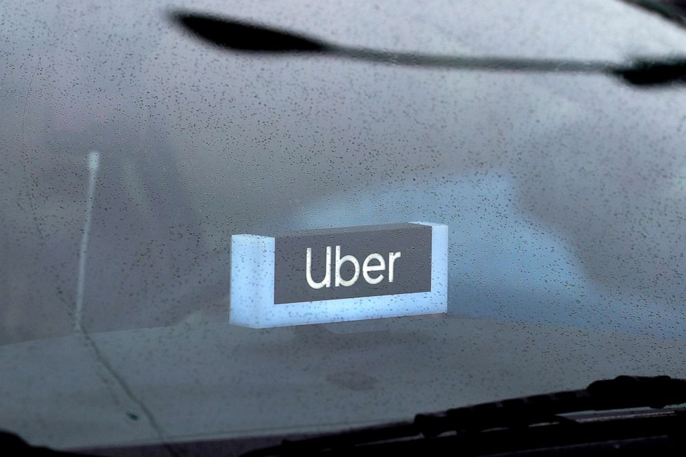 PHOTO: An Uber sign is displayed inside a car in Chicago, May 15, 2020.